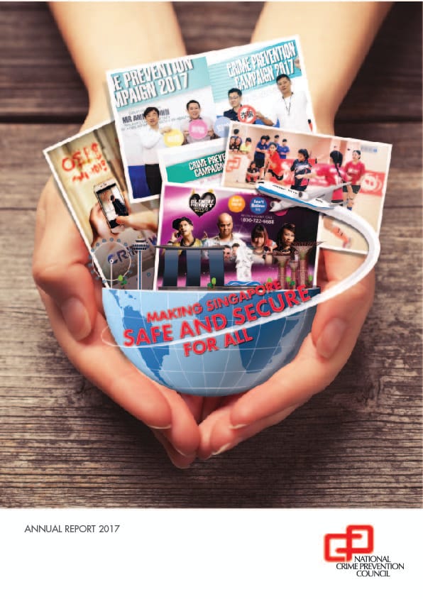 A cover design featuring a pair of hands cupping a small globe, out of which a collection of photographs, promotional materials from the "Crime Prevention Campaign 2017," and Singapore landmarks emerge, with the official NCPC logo at the bottom right.